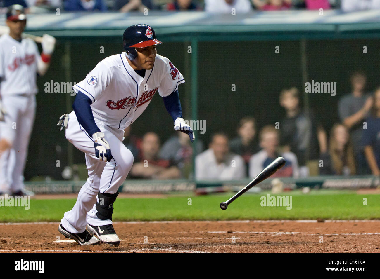 May 20, 2011 - Cleveland, Ohio, U.S - Cleveland pinch hitter Ezequiel Carrera (12) runs to first as he lays down a drag bunt for his first major league hit to drive in the winning run in the eighth inning against Cincinnati. The Cleveland Indians rallied to defeated the Cincinnati Reds 5-4 at Progressive Field in Cleveland, Ohio. (Credit Image: © Frank Jansky/Southcreek Global/ZUMA Stock Photo