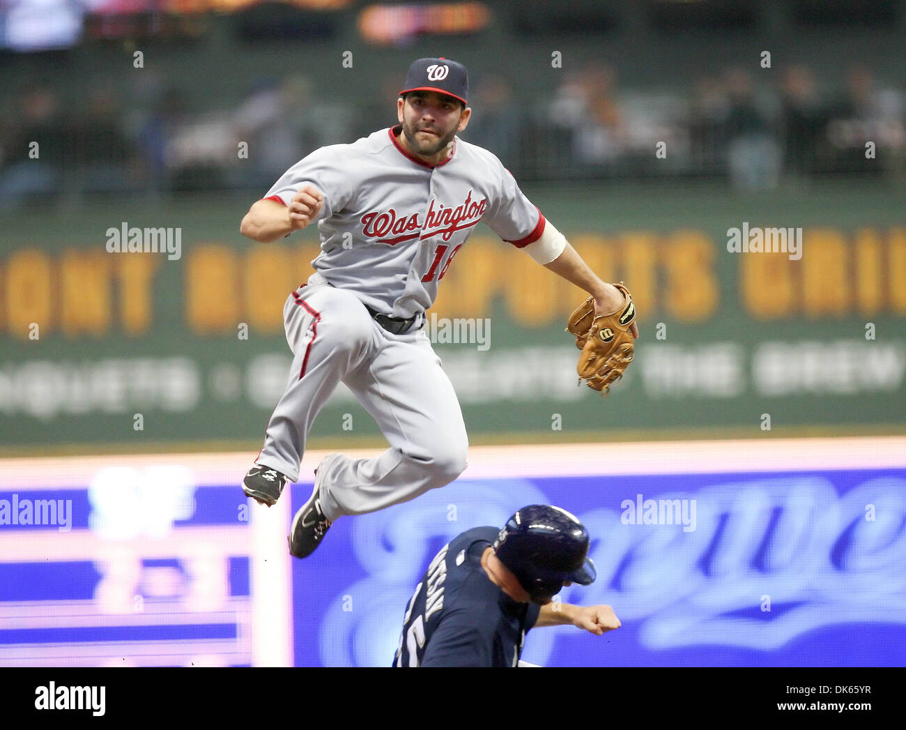 May 25, 2011 - Milwaukee, Wisconsin, U.S - Washington Nationals second baseman Danny Espinosa #18 jumps high into the air on a double play attempt at second base. The Milwaukee Brewers defeated the Washington Nationals 6-4 at Miller Park in Milwaukee. (Credit Image: © John Fisher/Southcreek Global/ZUMAPRESS.com) Stock Photo