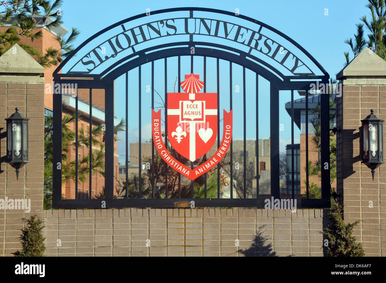 Sign with crest and Latin logo outside Saint John's University in