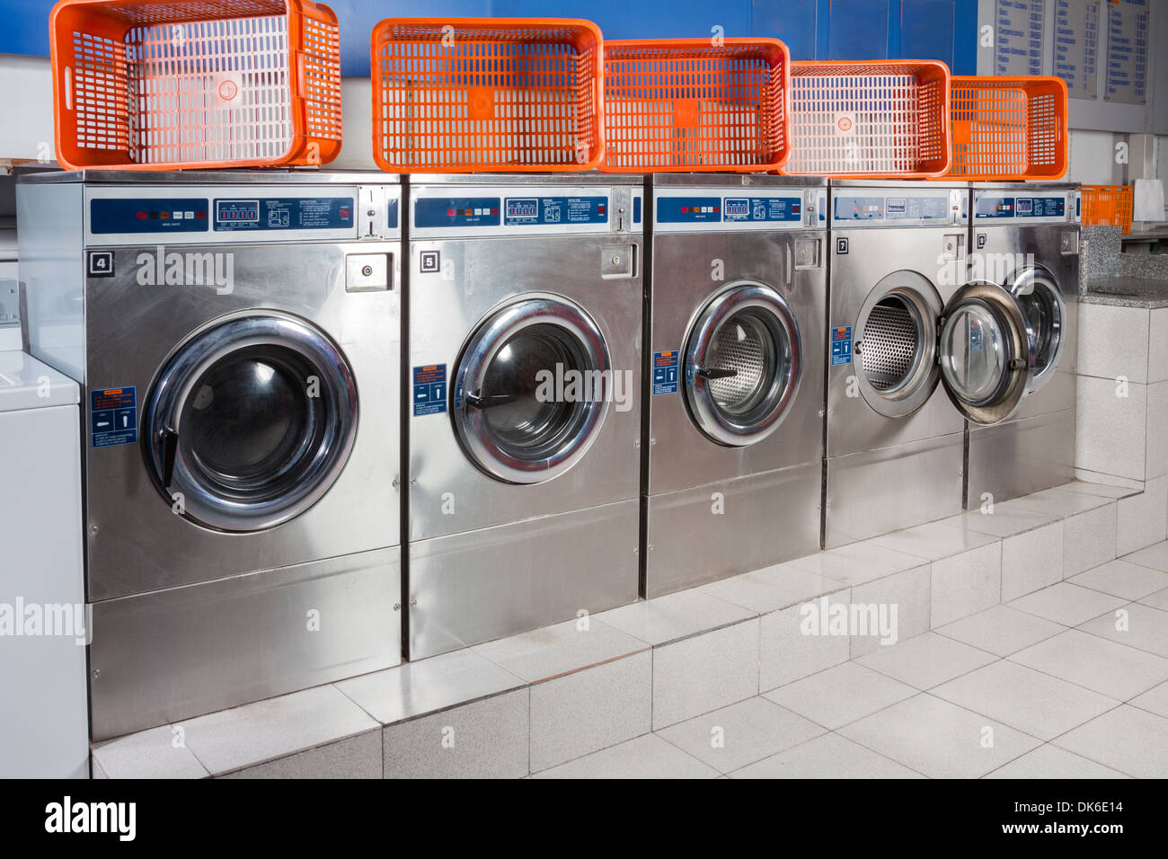 Washing Machines And Empty Baskets In A Row Stock Photo