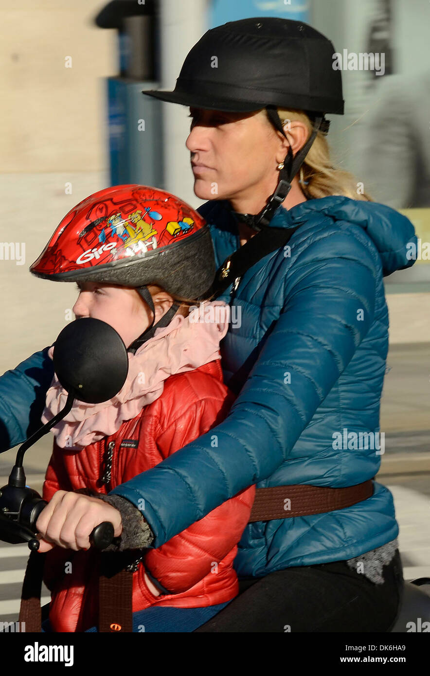 Edie Falco rides a scooter in Tribeca with her daughter Macy New York