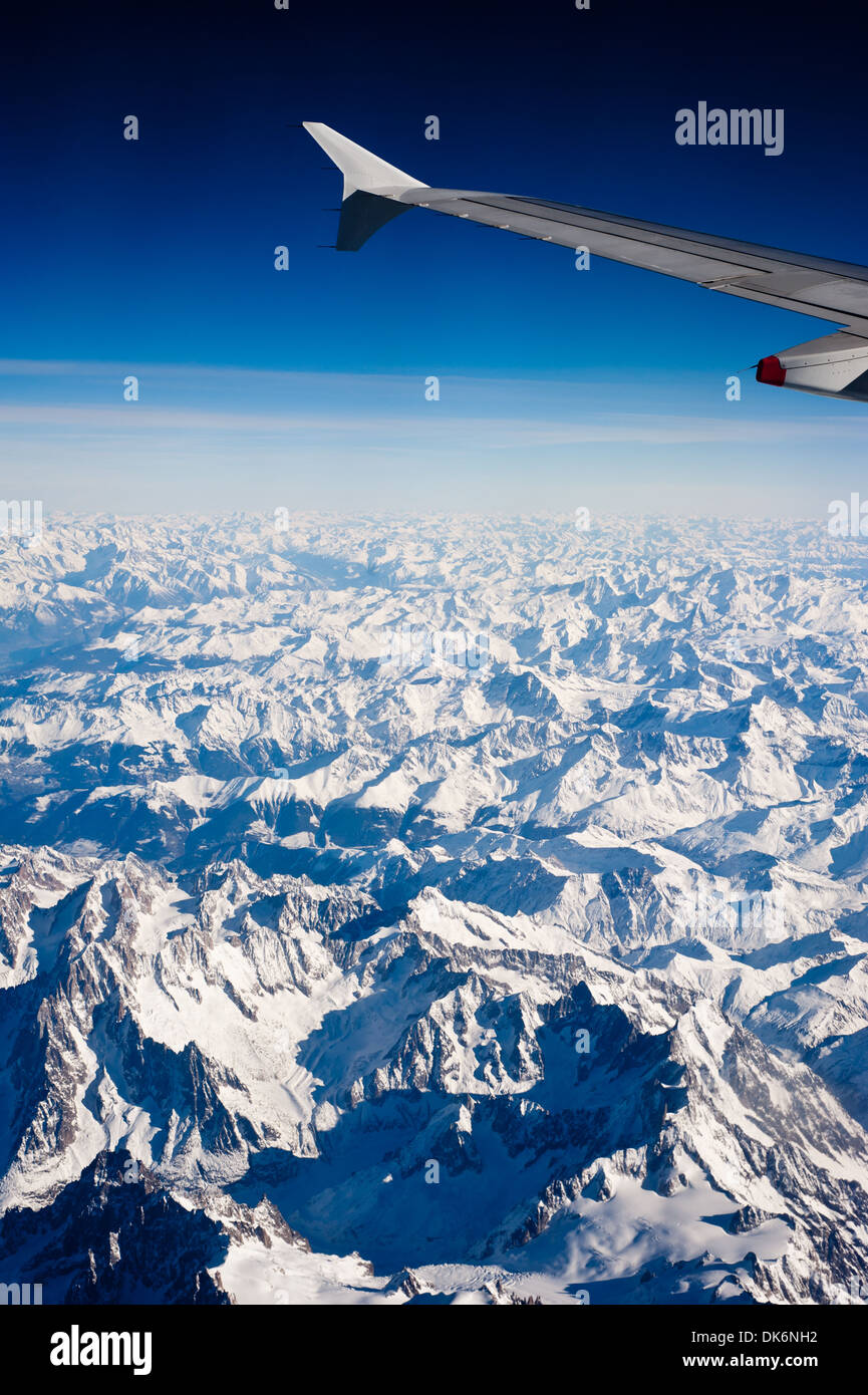 Aerial view of snow capped Alps mountains between Switzerland and Italy ...