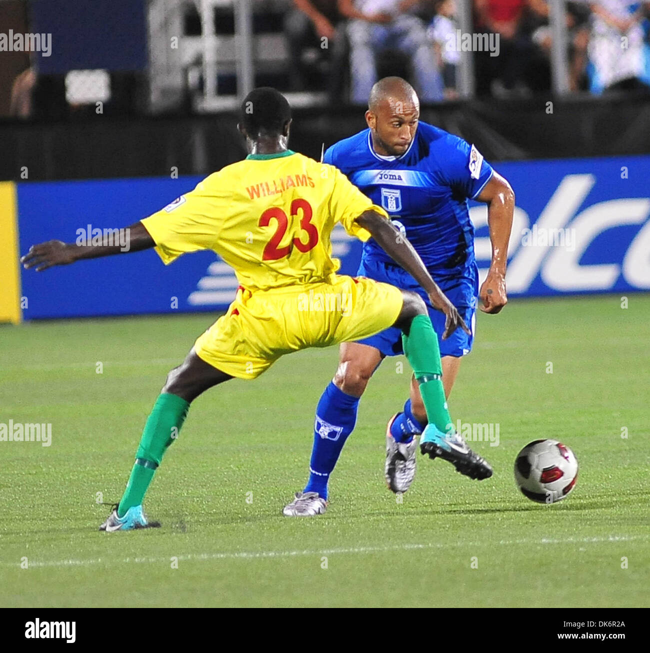 June 10, 2011 - Miami, FL, U.S. - June 10, 2011 - Miami, Florida, U.S  - Victor Bernardez (5), right, from Honduras vies for the ball against Junior Williams (23), left, of Grenada in the first half of a CONCACAF Gold Cup soccer match at Florida International University in Miami, Florida, Friday June 10, 2011. (Credit Image: © Gaston De Cardenas/ZUMAPRESS.com) Stock Photo