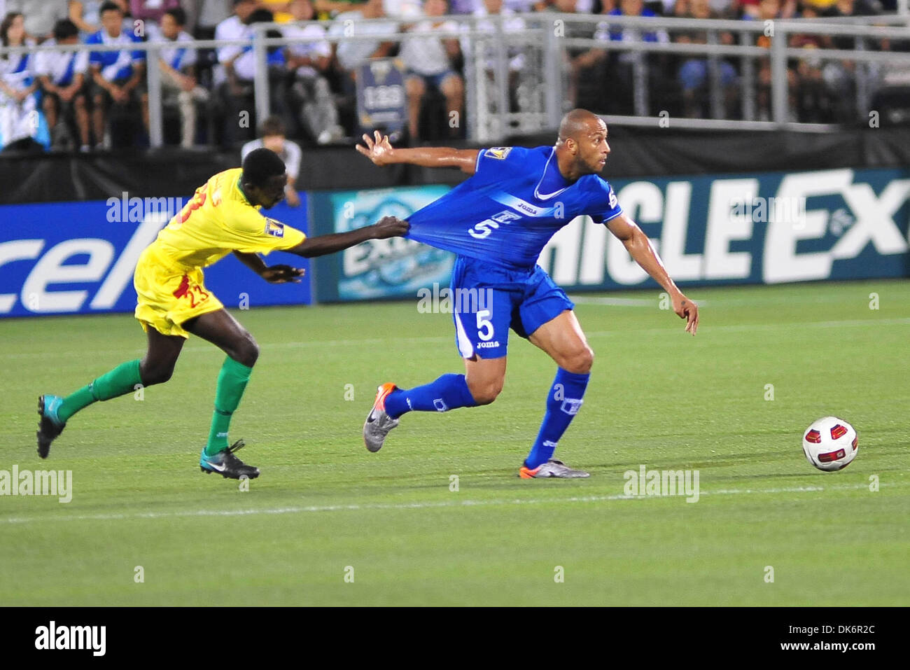 June 10, 2011 - Miami, FL, U.S. - June 10, 2011 - Miami, Florida, U.S  - Victor Bernardez (5), right, from Honduras vies for the ball against Junior Williams (23), left, of Grenada in the first half of a CONCACAF Gold Cup soccer match at Florida International University in Miami, Florida, Friday June 10, 2011. (Credit Image: © Gaston De Cardenas/ZUMAPRESS.com) Stock Photo