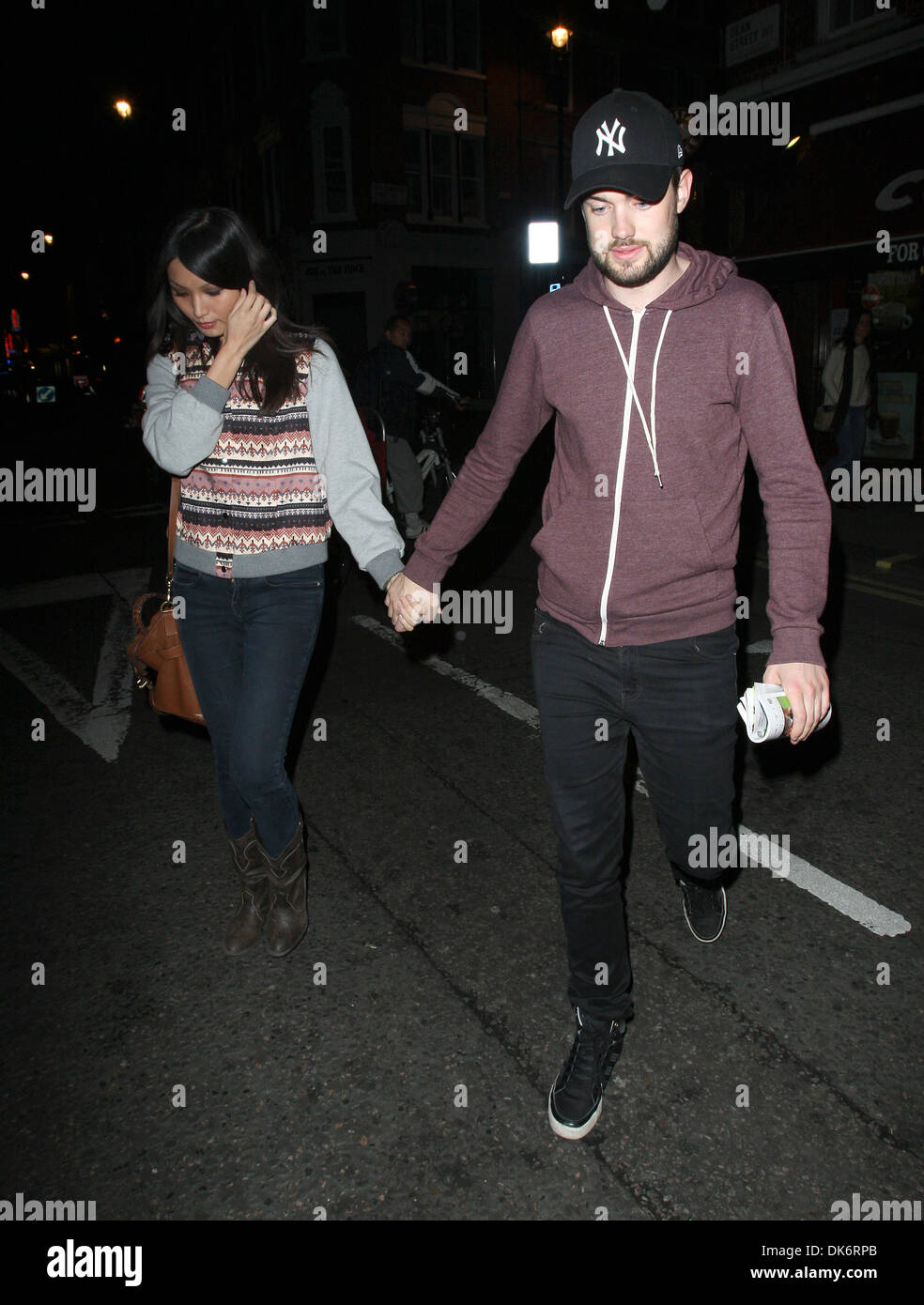 Jack Whitehall and Gemma Chan outside the Groucho club in Soho London, England - 27.09.12 Stock Photo