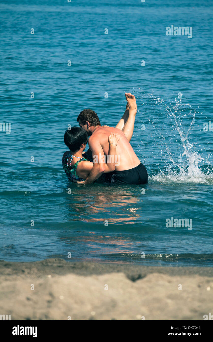 Young happy couple enjoying summer and sea. Stock Photo