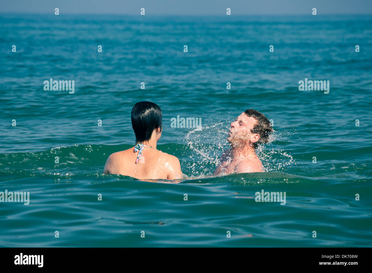 Young happy couple enjoying summer and sea. Stock Photo