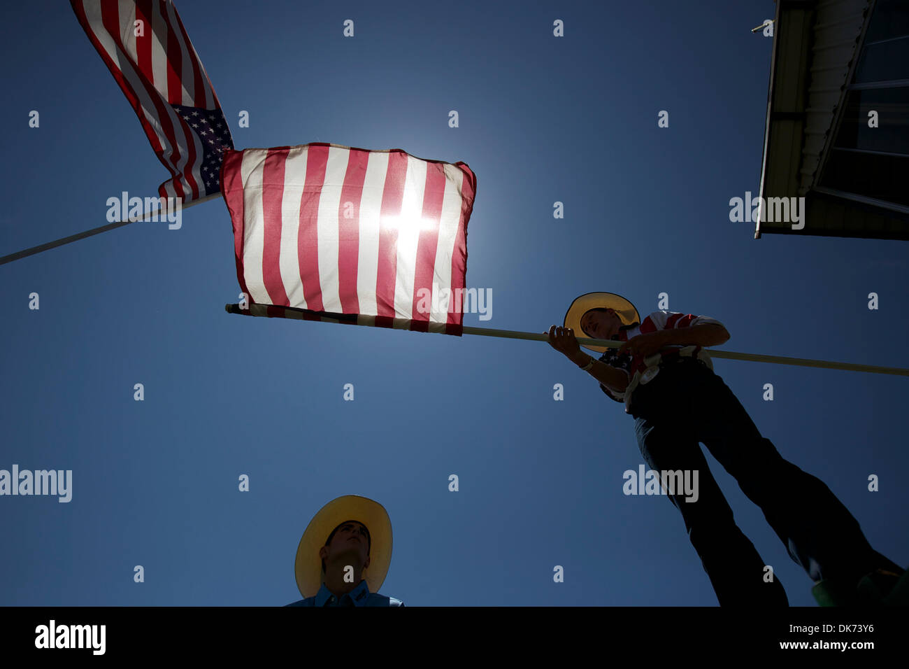 June 12, 2011 - Livermore, California, U.S - Arena workers unfurl an American flag at the 93rd Annual Livermore Rodeo at Robertson Park. (Credit Image: © Matt Cohen/Southcreek Global/ZUMAPRESS.com) Stock Photo