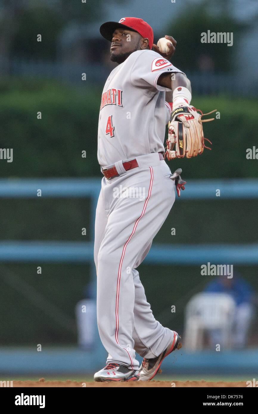 Cincinnati Reds second baseman Brandon Phillips (4) claps and looks towards  the sky after hitting a double during the Cincinnati Reds' game against the  St. Louis Cardinals at Busch Stadium in St.