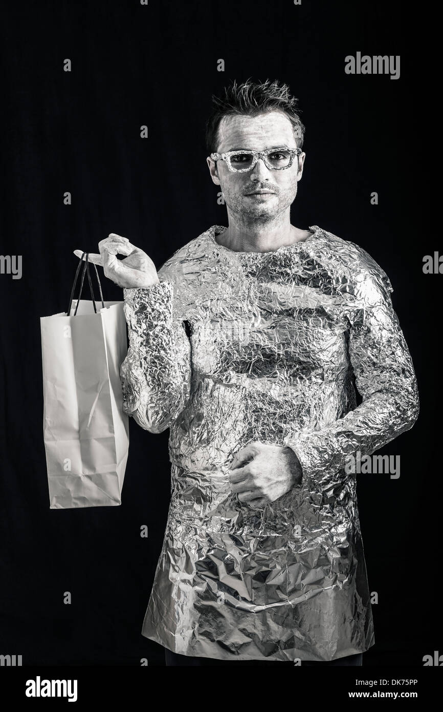 Portrait of alien man holding shopping bag. Stock Photo