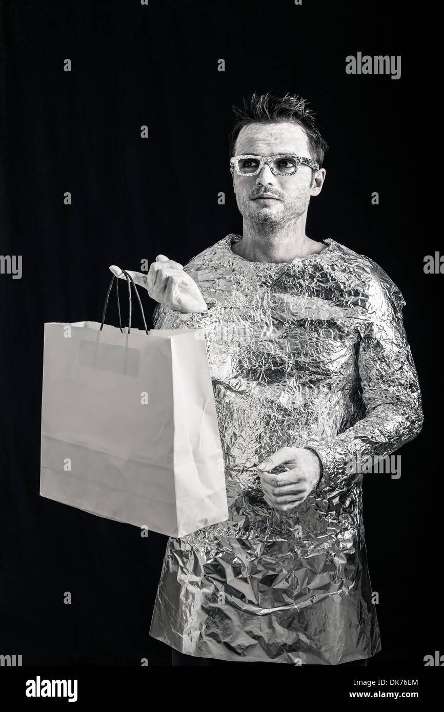 Portrait of alien man holding shopping bag. Stock Photo
