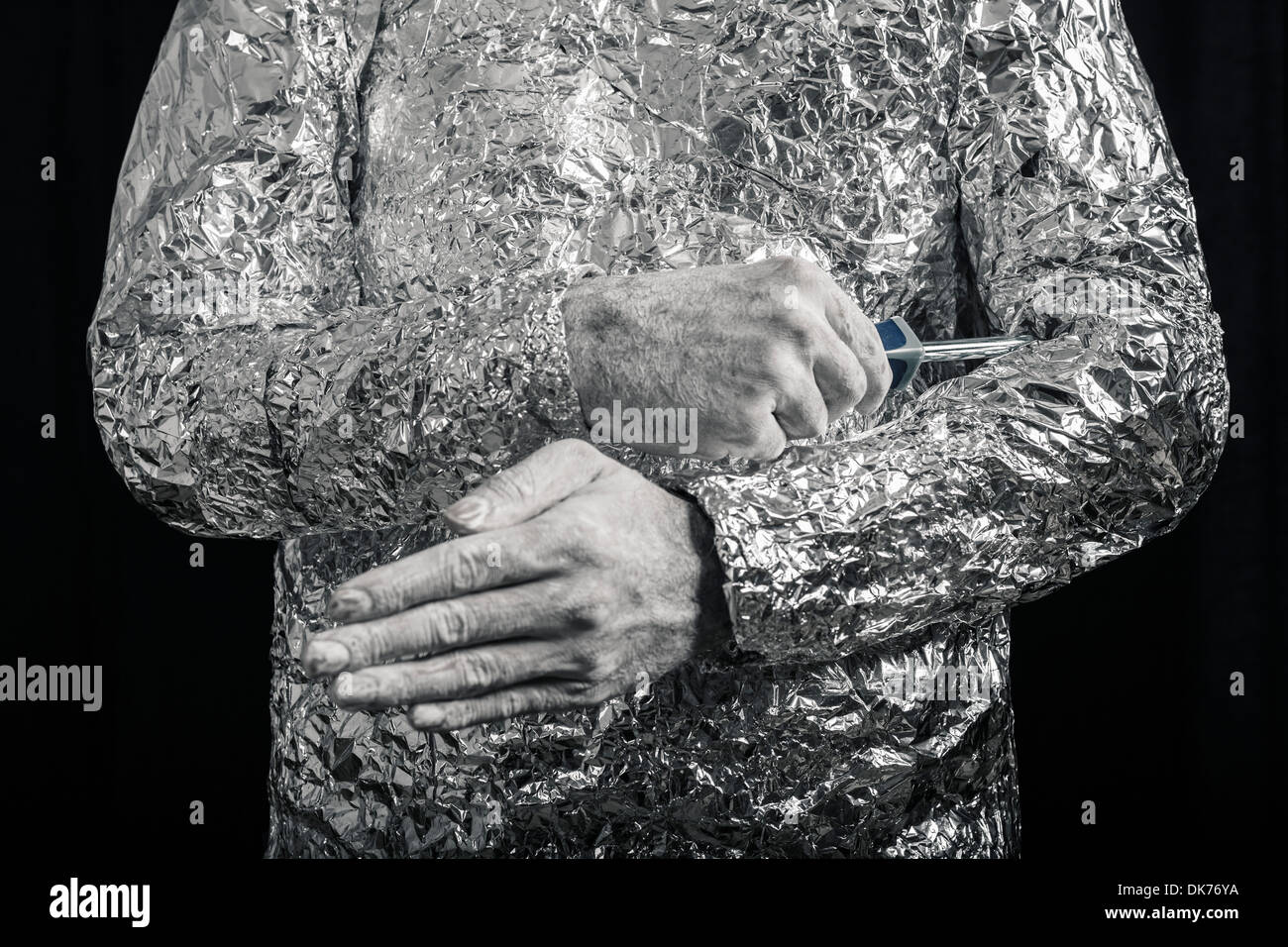 Closeup of cyborg fixing himself with screwdriver. Stock Photo
