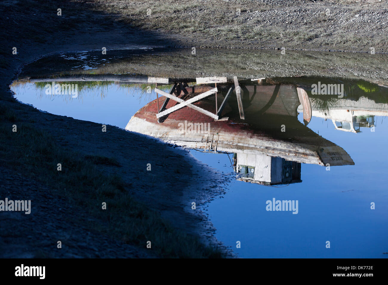 A shipwreck at a junkyard on The Spit in Homer, Alaska, USA Stock Photo
