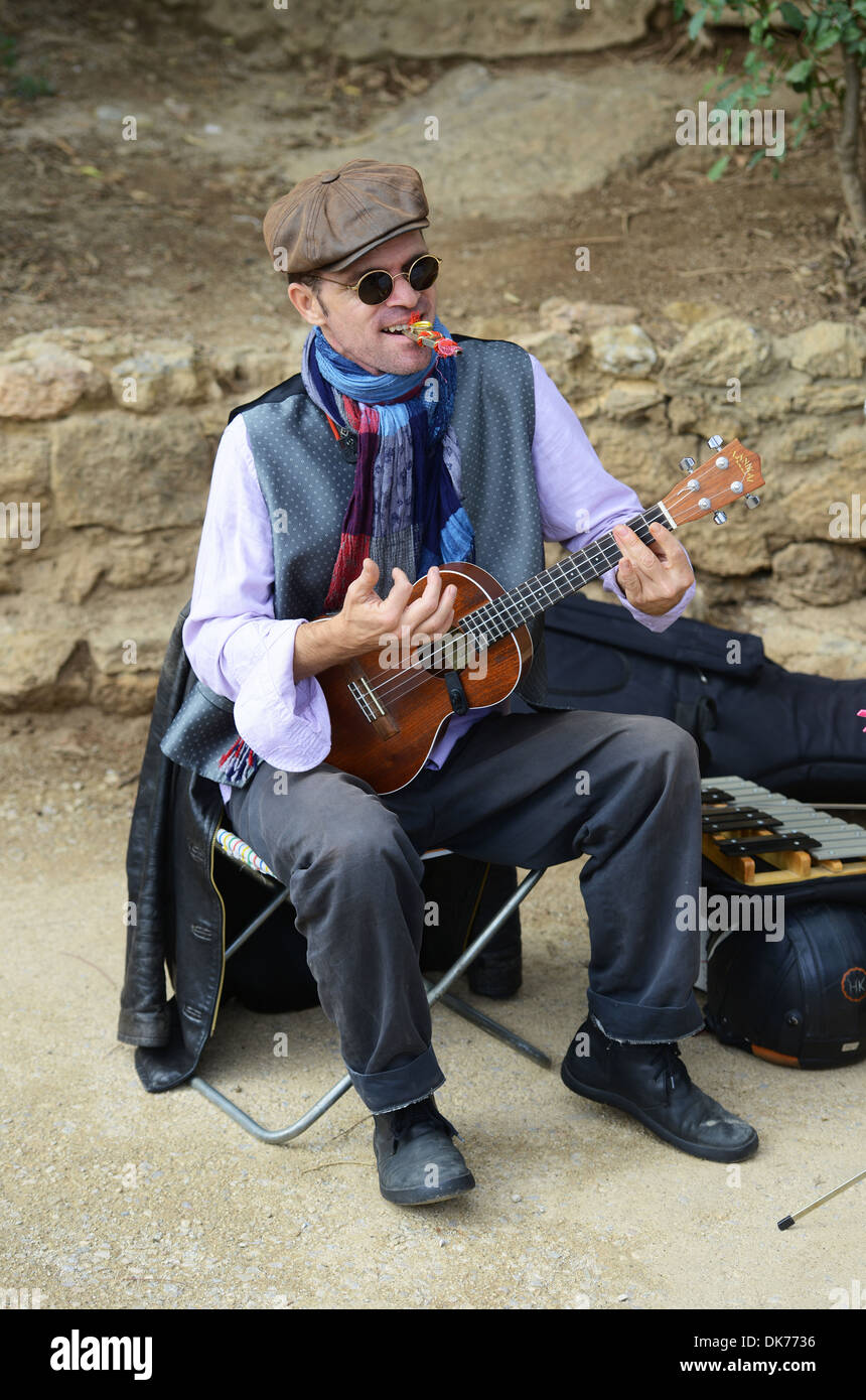 Street entertainer musician playing guitar, Barcelona, Spain Stock