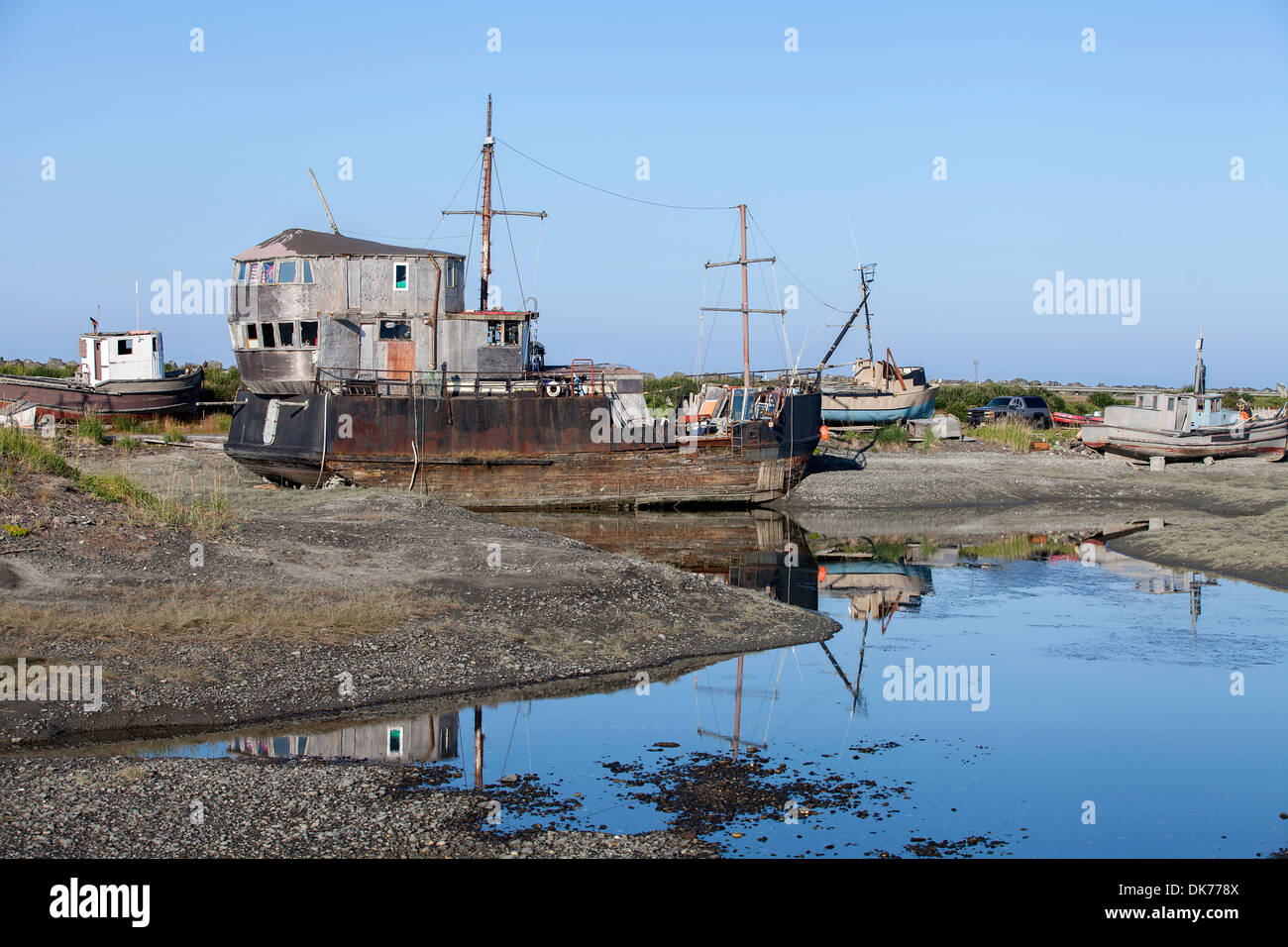 A shipwreck at a junkyard on The Spit in Homer, Alaska, USA Stock Photo