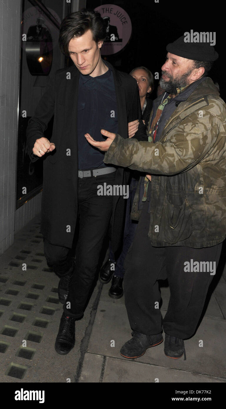 Matt Smith is approached by an eager homeless man asking him for money as he leaves Groucho club London England - 27.09.12 Stock Photo