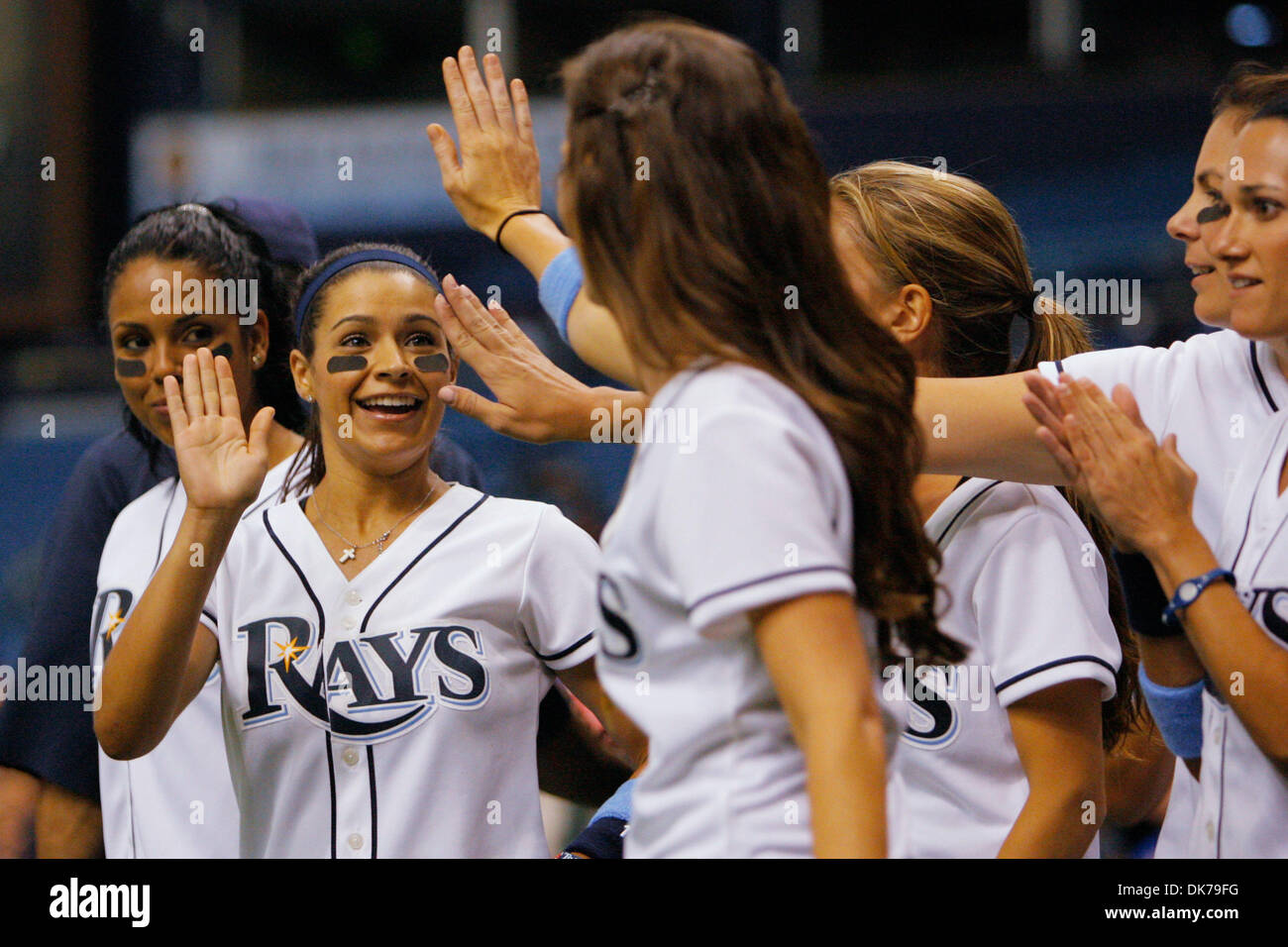 June 18, 2011 - St. Petersburg, FL, USA - SP 335922 FOUN RAYS 2.EDMUND D. FOUNTAIN | Times .(06/18/2011 St. Petersburg) Giselle Rodriguez, left, wife of Tampa Bay Rays infielder Sean Rodriguez, high-fives her teammates after scoring a run in the innaugural Rays/Marlins wives softball game on June 18, 2011. The Tampa Bay Rays played the Florida Marlins on June 18, 2011 at Tropicana  Stock Photo