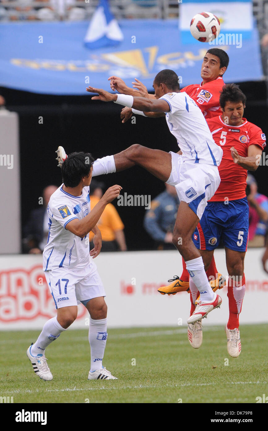 June 18, 2011 - East Rutherford, New Jersey, U.S - Costa Rica's Jhonny Acosta (3, in back) heads a ball away from teammate Celso Borges (5) and Honduras' Jerry Bengtson (9)during first half CONCACAF Gold Cup action between Costa Rica and Honduras at the New Meadowlands Stadium in East Rutherford, N.J. (Credit Image: © Will Schneekloth/Southcreek Global/ZUMAPRESS.com) Stock Photo