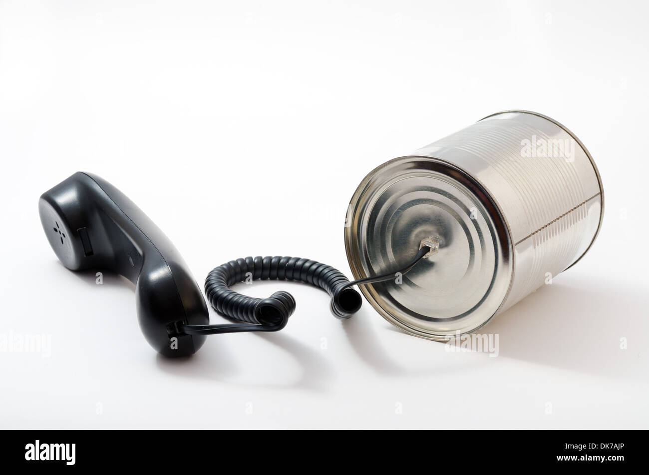telephone and tin can on a white background. technological leap. Stock Photo
