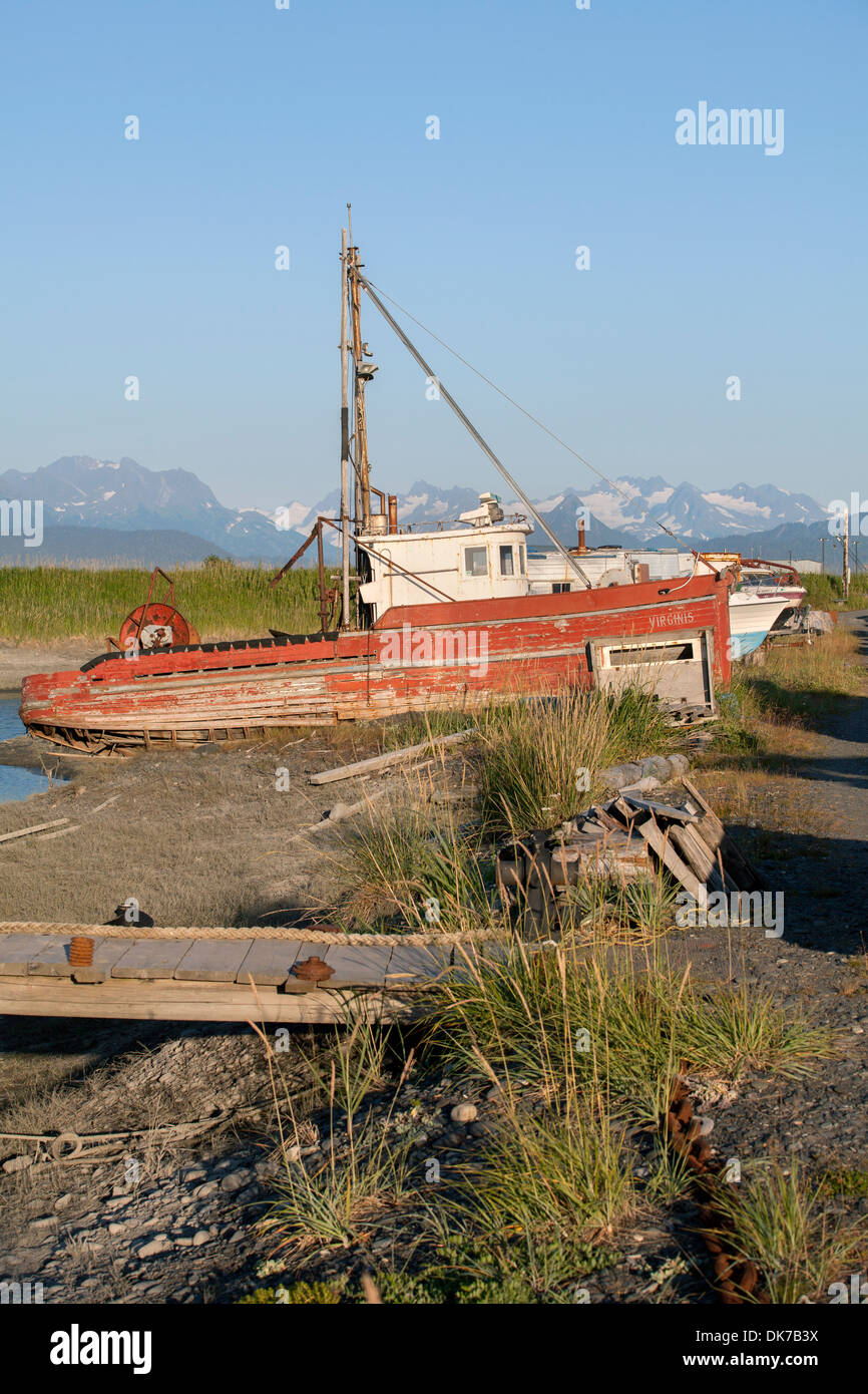 A shipwreck at a junkyard on The Spit in Homer, Alaska, USA Stock Photo
