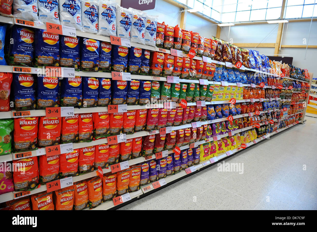 Supermarket interior showing packets of crisps, Britain, UK Stock Photo