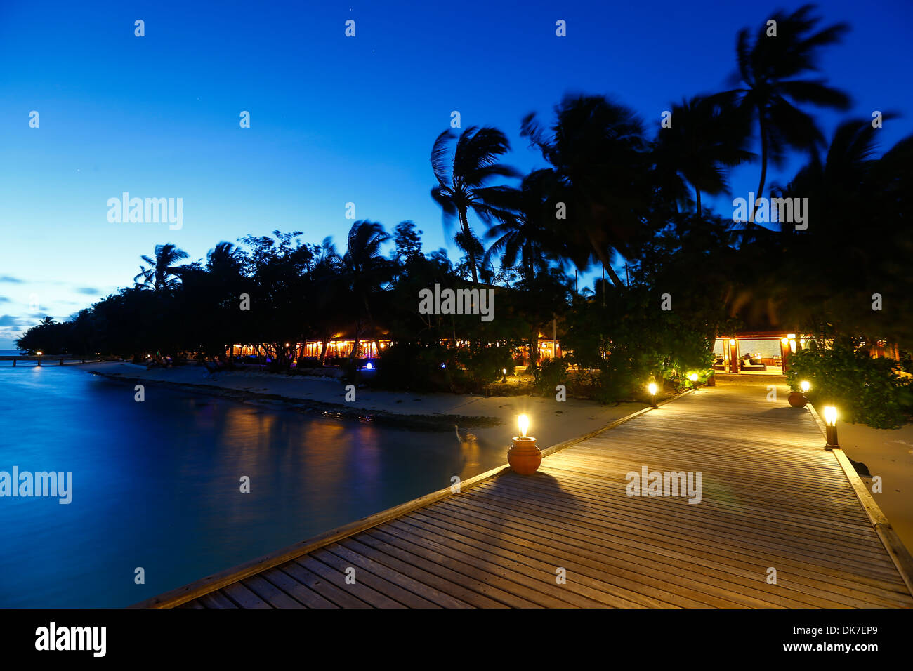 maldives accomodations on bounty island paradise at night with full moon Stock Photo