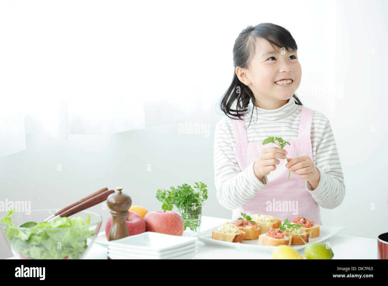 Japanese girl cooking Stock Photo