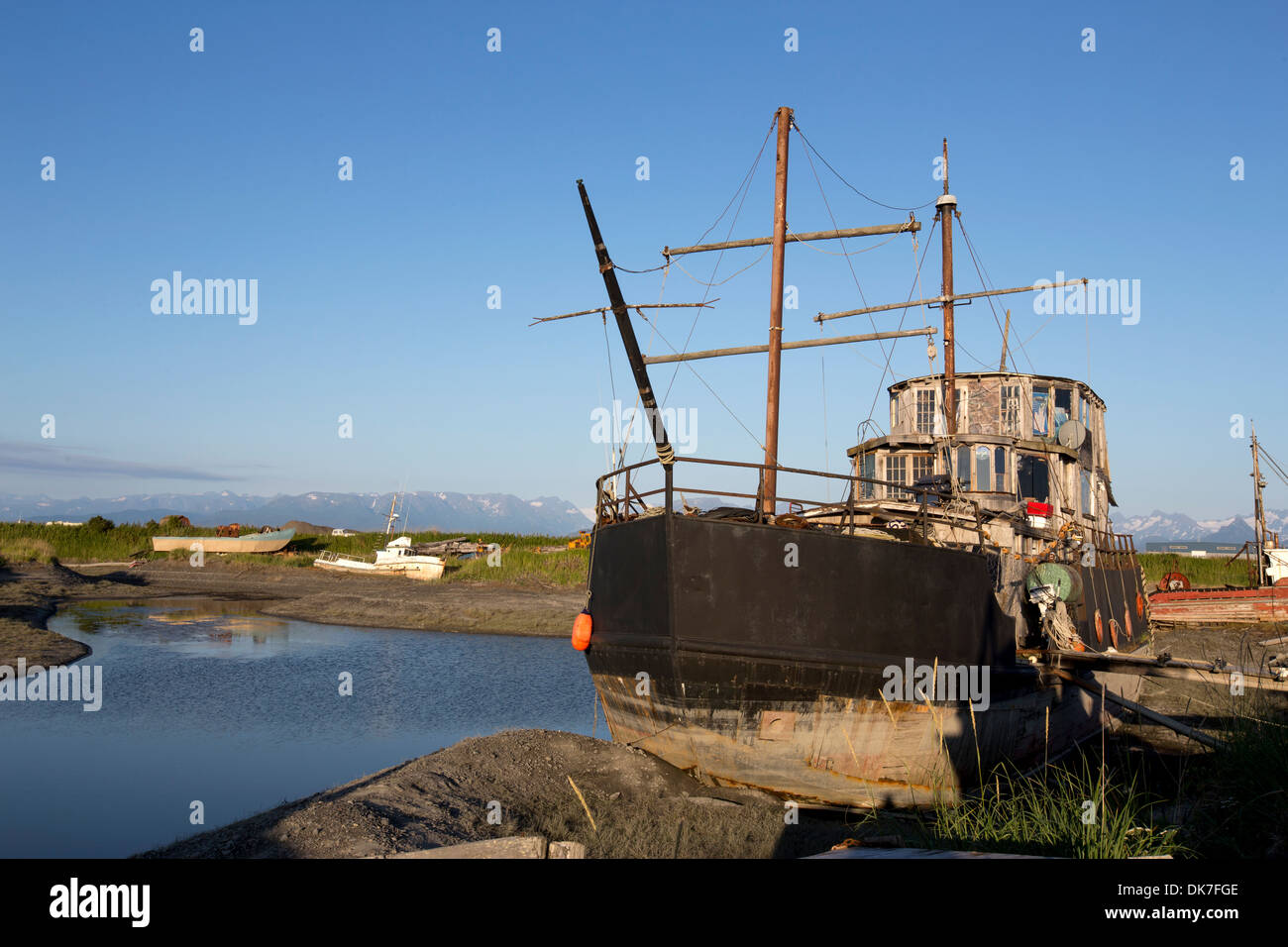 A shipwreck at a junkyard on The Spit in Homer, Alaska, USA Stock Photo