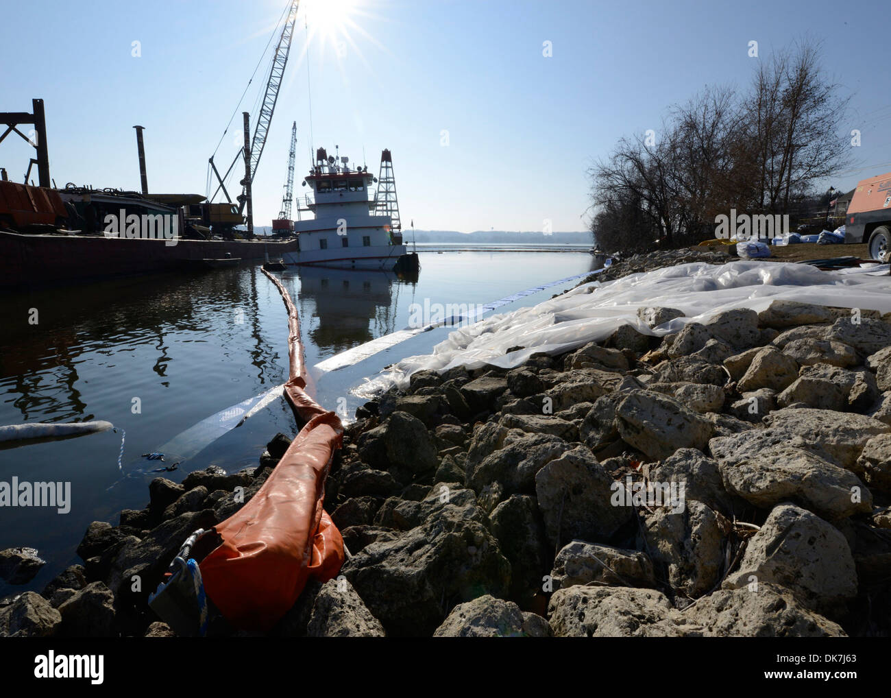 LECLAIRE, Iowa - The towboat Stephen L. Colby sits boomed off on the right descending bank of the Mississippi River near downtown LeClaire while response crews conduct cleanup and salvage operations, Dec. 1, 2013. The Stephen L. Colby sank after hitting a Stock Photo