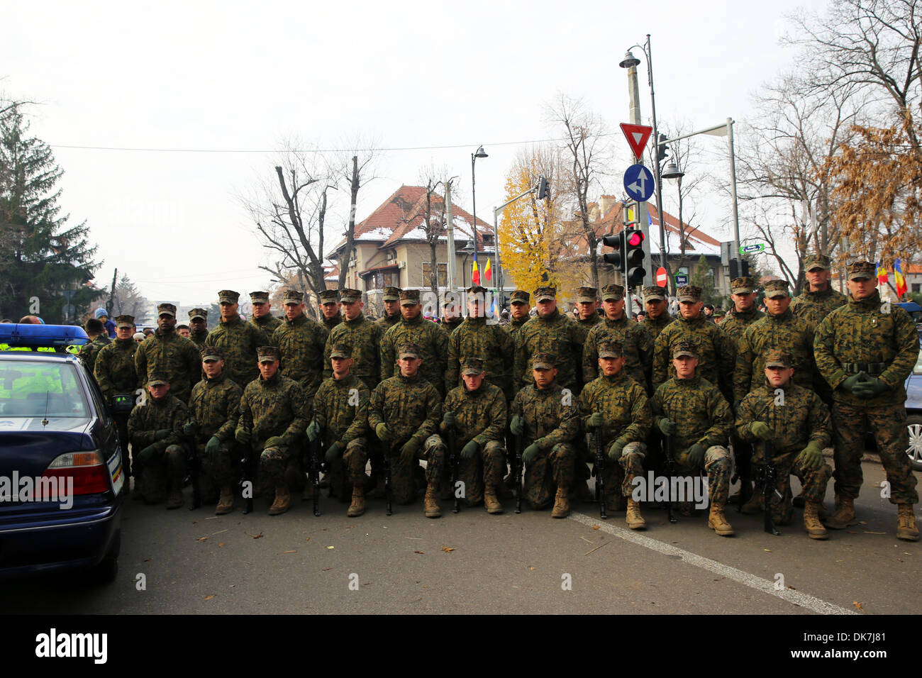 A platoon of Marines with Black Sea Rotational Force 14 poses after marching in the Romanian National Day parade through Bucharest, Romania Dec. 1, 2013. The parade went through the center of town and under the Arch of Triumph. This national holiday celeb Stock Photo