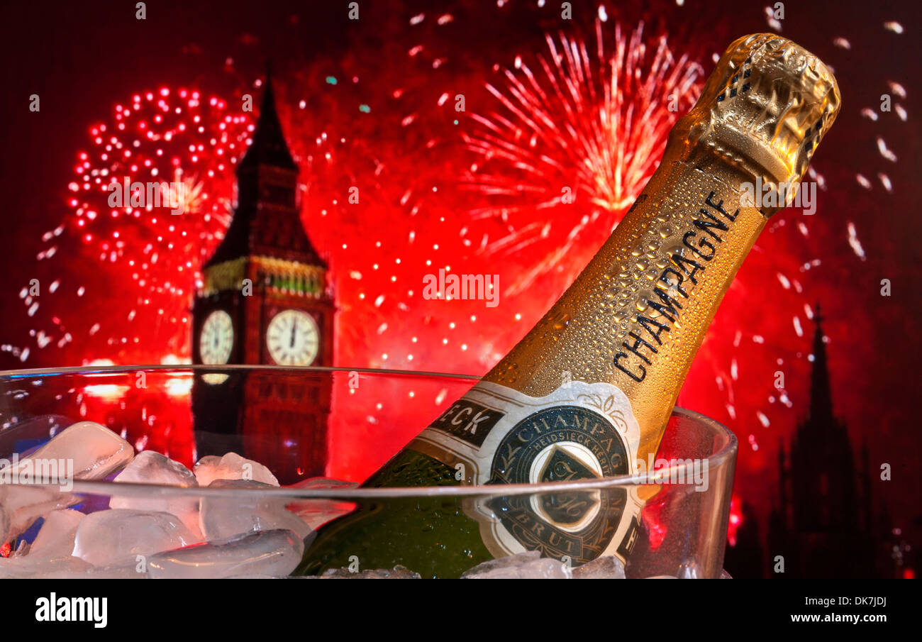 Bottle of champagne on ice in wine cooler with Big Ben behind at midnight with big celebration party fireworks Stock Photo