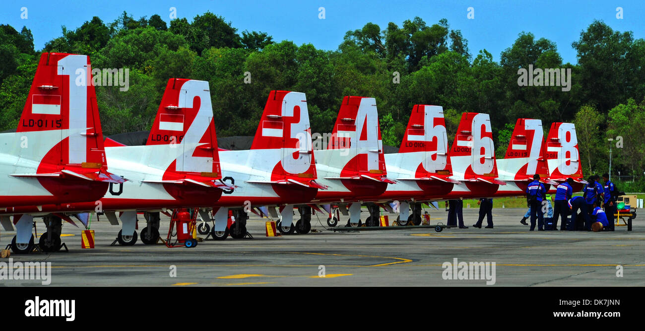 RIMBA AIR BASE, Brunei -- Crew members from the Indonesian Jupiter Aerobatic Team perform post flight procedures after a practice flight on the flightline at Rimba Air Base during the 4th Biennial Brunei Darussalam International Defense Exhibition, Dec. 1 Stock Photo