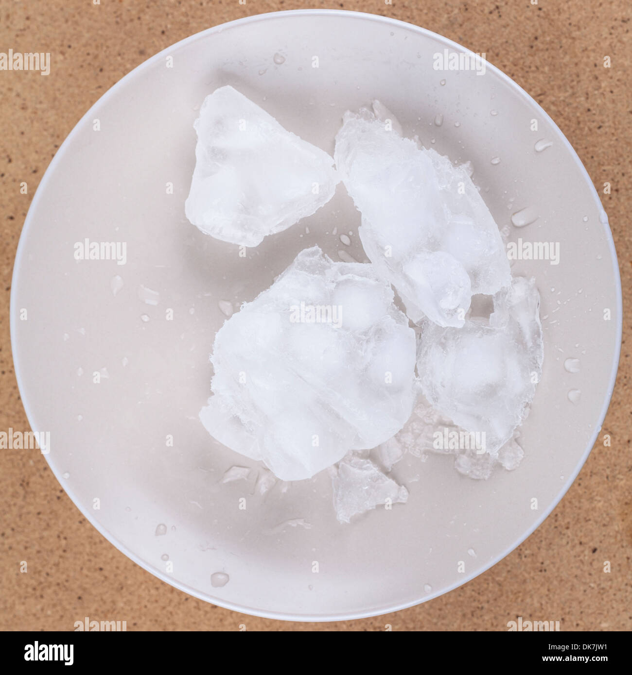 Frozen ice water on plate Stock Photo Alamy