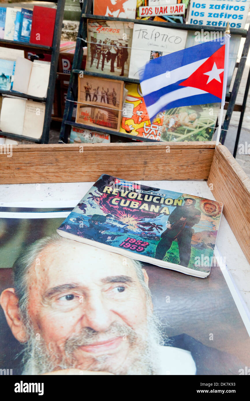 Books about the Revolution, Cuban flag and painting of Fidel Castro, Place de Armas Square, Havana Cuba Caribbean Stock Photo