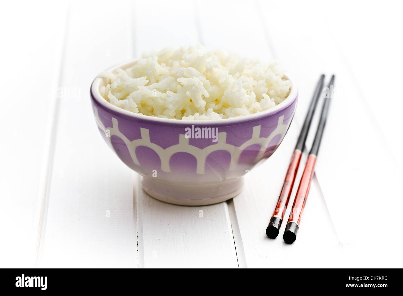 ceramic bowl with jasmine rice and chopsticks Stock Photo