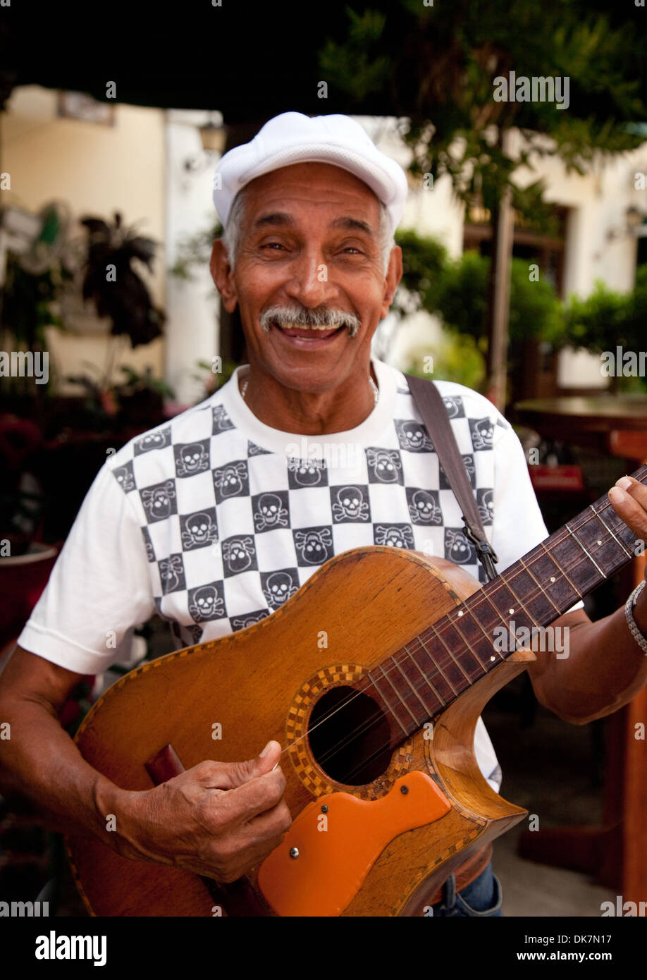 Cuba music - Elderly Cuban musician man playing his guitar in the street, example of local culture, Havana, Cuba, Caribbean, Latin America Stock Photo