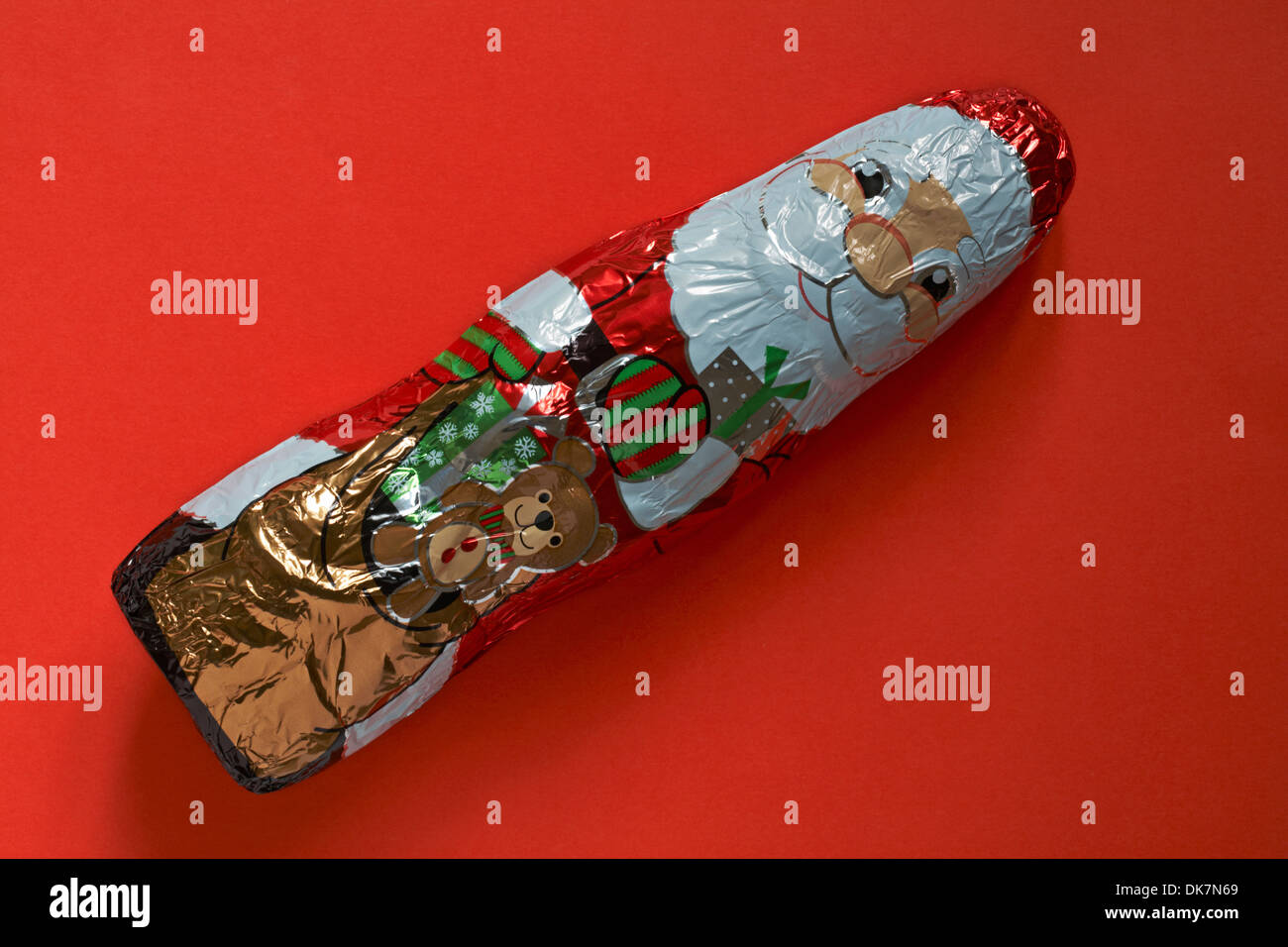 Santa Claus milk chocolate Father Christmas - chocolates ready for Christmas isolated on red background Stock Photo