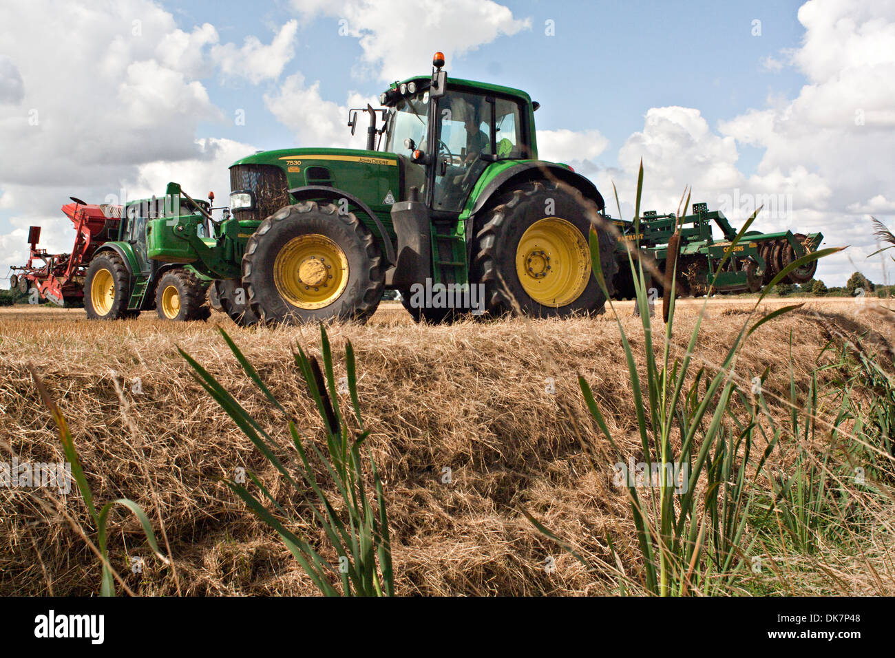 John Deere tractor harrowing Fenland field Stock Photo - Alamy