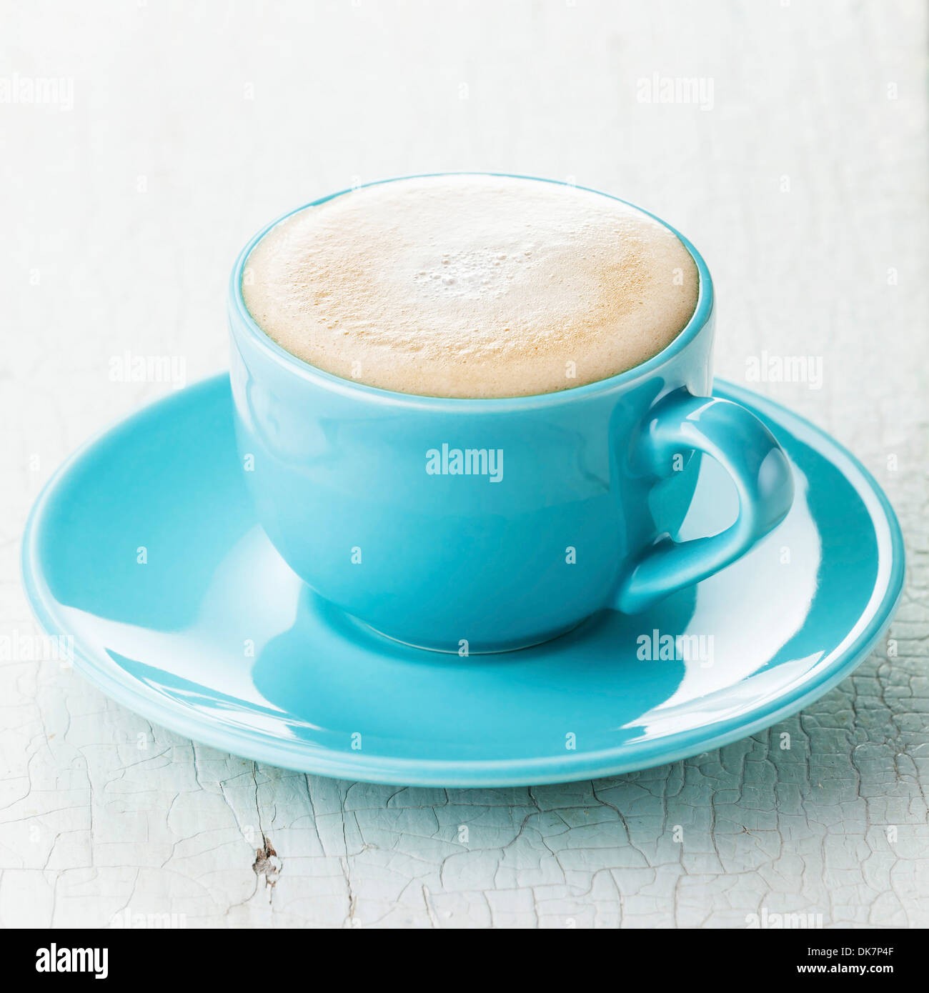 Cappuccino coffee in blue coffee cup Stock Photo