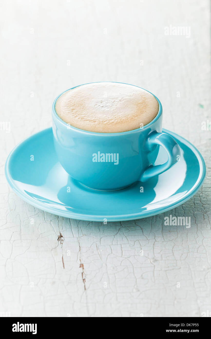 Cappuccino coffee in blue coffee cup Stock Photo