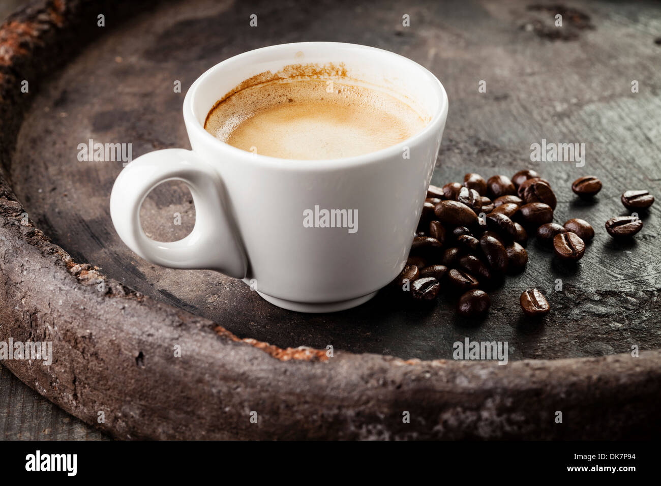 Coffee cup with coffee beans on dark background Stock Photo