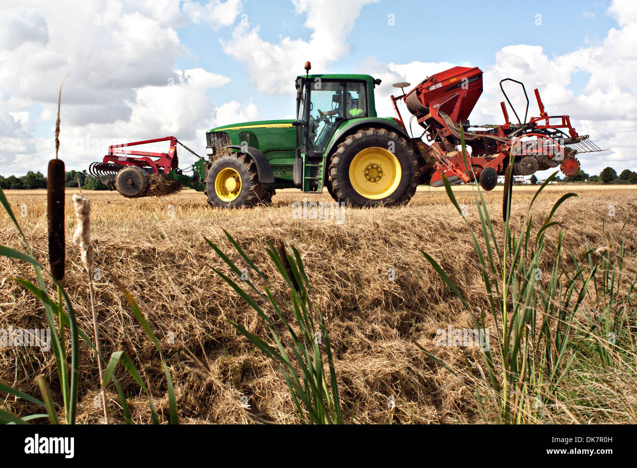 John Deere tractor harrowing Fenland field Stock Photo - Alamy
