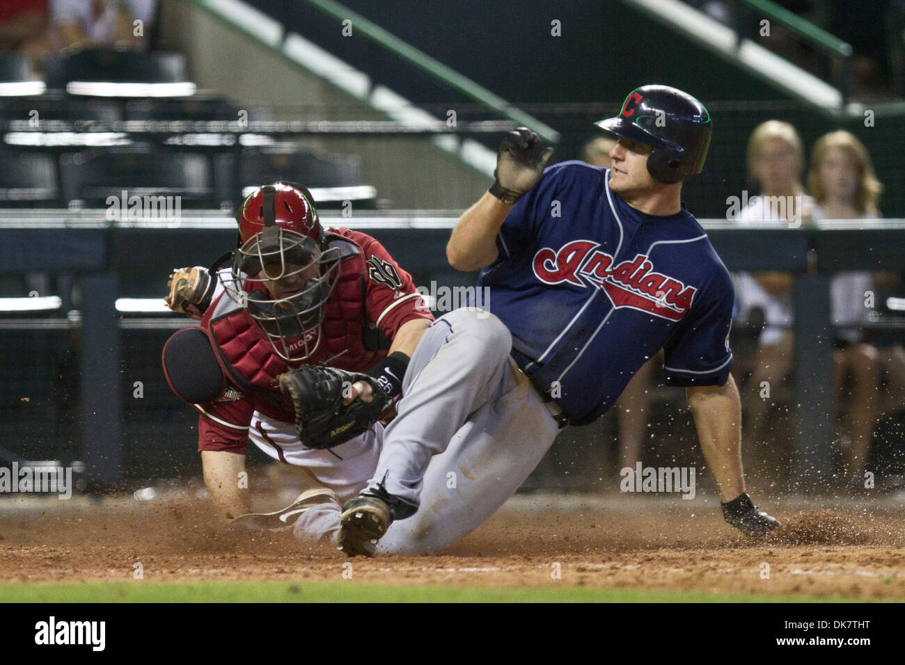 June 29, 2011 - Phoenix, Arizona, U.S - Cleveland Indians' catcher Lou Marson (6) slides into home ahead of the tag from Arizona Diamondbacks' catcher Miguel Montero (26) during the 9th inning. The Indians defeated the Diamondbacks 6-2 in the final game of a three game interleague series at Chase Field in Phoenix, Arizona. (Credit Image: © Chris Pondy/Southcreek Global/ZUMAPRESS.co Stock Photo