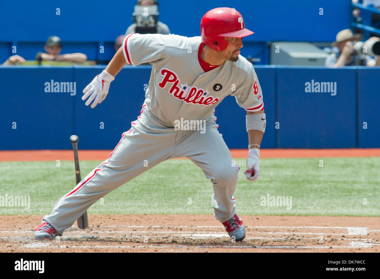 Philadelphia Phillies' Shane Victorino, left, throws as manager