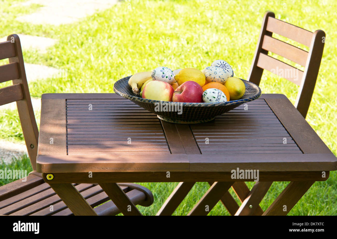 a desk with two chairs in the garden Stock Photo - Alamy