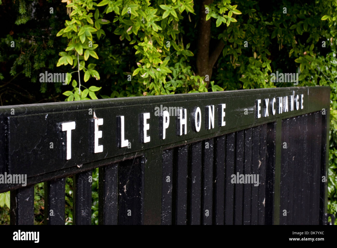 Raised lettering on the gates to a rural telephone exchange Stock Photo