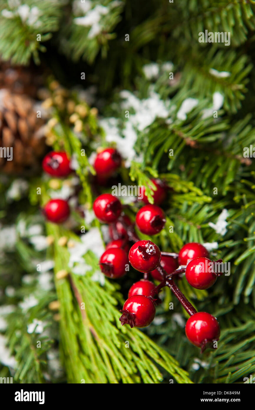 Green Holiday Christmas Decoration with Evergreen and Berries Stock Photo