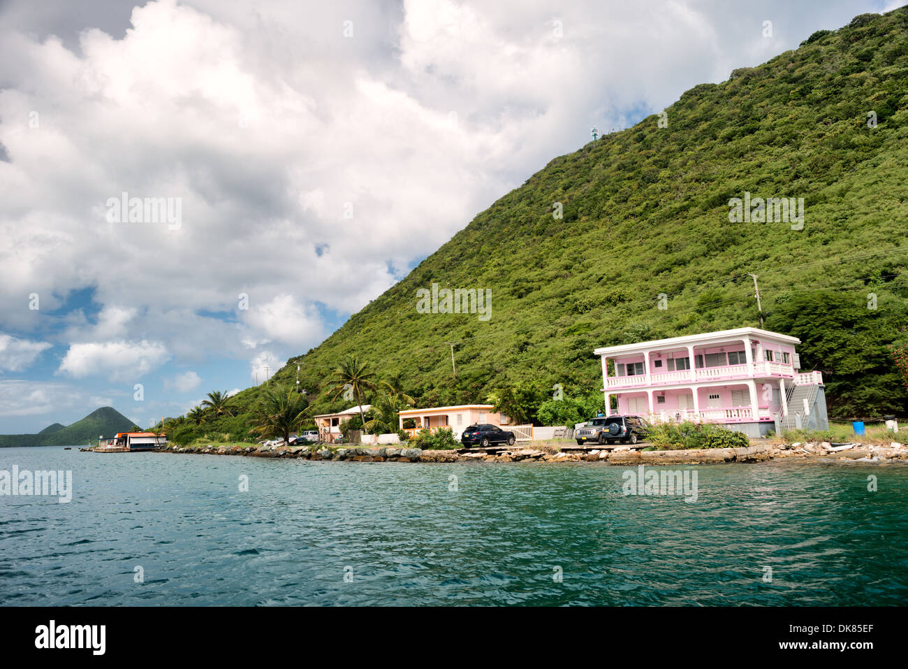 The waterfront of West End Harbour on Tortola in the British Virgin Islands. Known for its diverse marine life and coral reefs, the Caribbean region boasts some of the world's most beautiful and well-preserved beachscapes. Stock Photo