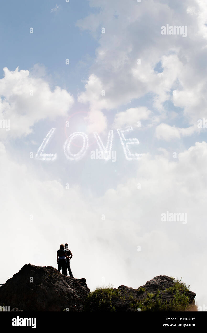 Young Couple In Love Looking At The Sky With The Word Love Written Stock Photo Alamy Young Couple In Love Looking At The Sky With The Word Love Written Stock Photo Alamy