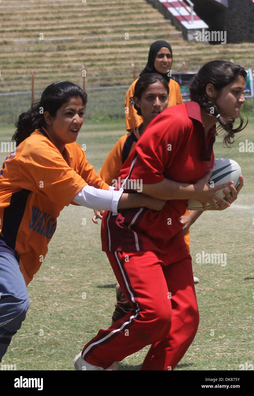 Jul 11, 2011 - Srinagar, Kashmir, India - Kashmiri muslim School girls in take part during final match of 5th State Rugby 7's Tournament at Bakshi Stadium in Srinagar, the summer capital of Indian Kashmir. (Credit Image: © Altaf Zargar/ZUMAPRESS.com) Stock Photo